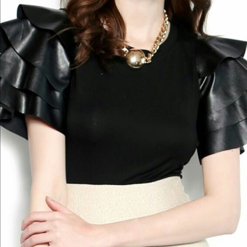 Black tee trimmed in black faux leather